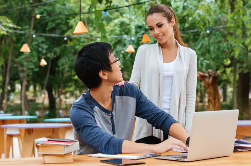 A milennial couple discussing personal finances with each other to stay on the same page and have matching goals.