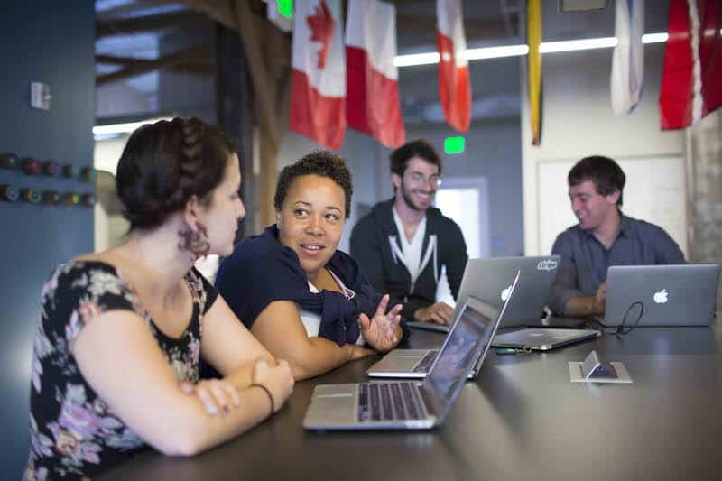 Stripe team members discussing work with eather. Stripe is a hot company and a hot potential investment as it becomes public in the near future.