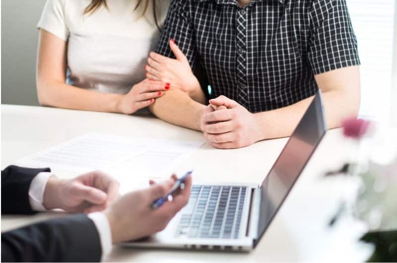 A young couple is stressed out after meeting with their financial advisor because it has become even more complicated.