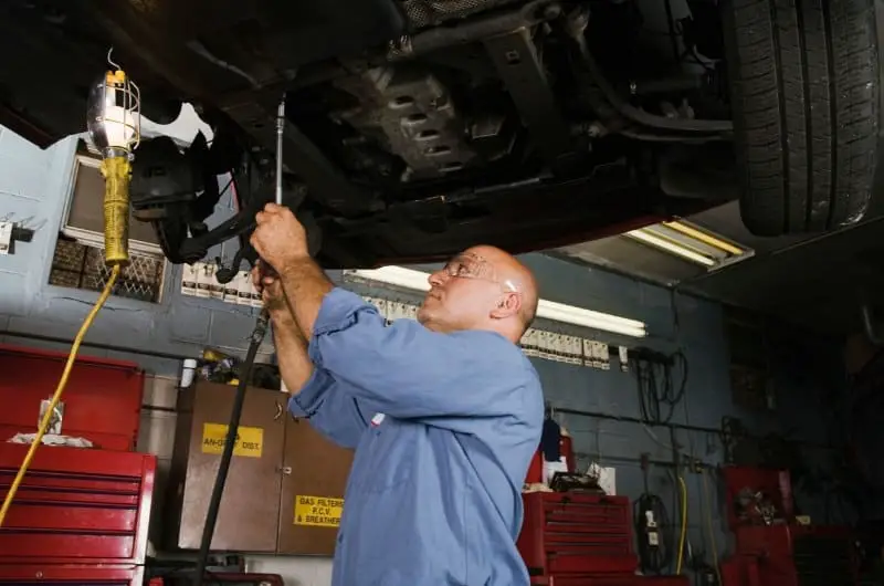 A mechanic is fixing a customer's car.