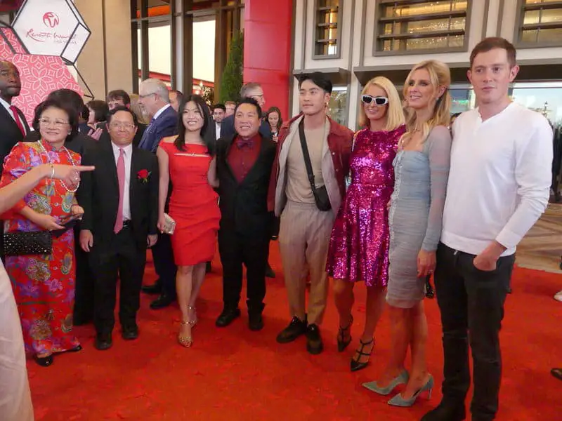 Various "old money" wealthy people at an event, Paris Hilton among one of them.