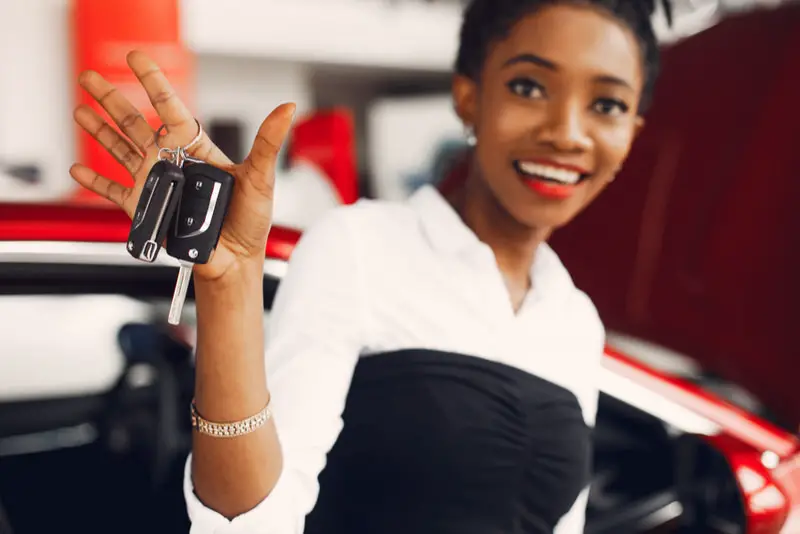 A young woman just bought her second car to use for commuting to work