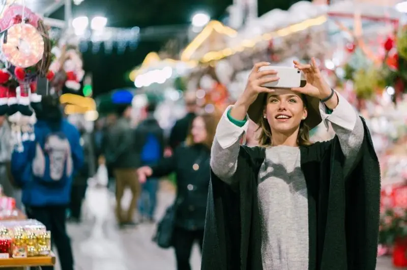 A young girl is traveling around Europe in the fall, when there are fewer tourists.