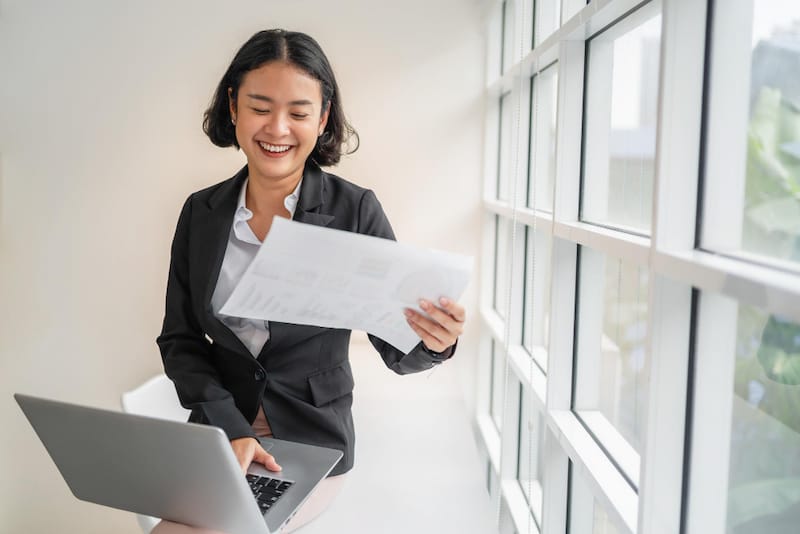 A woman is happy after figuring out some alternative options for life insurance that worked for her needs