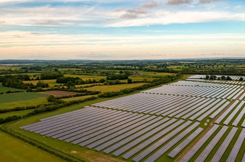 A large solar farm used to generate energy and sell to the grid for profit by the farm owner