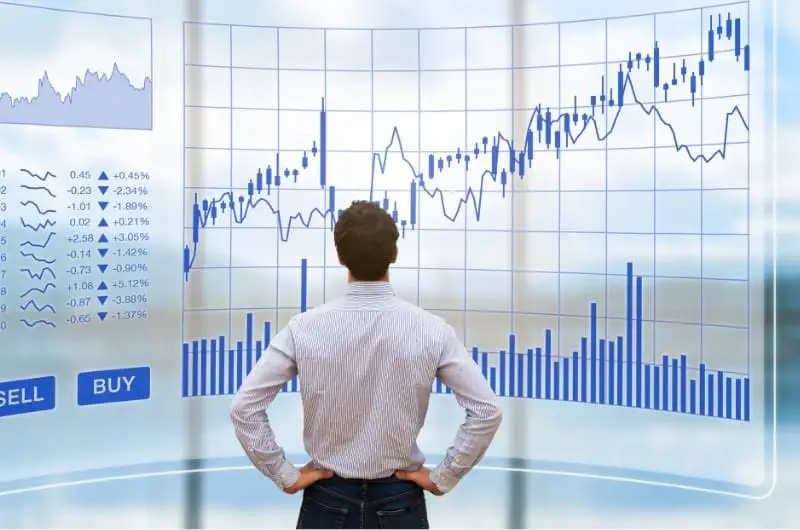 A young man is considering the pros and cons of buying HIVE stocks.