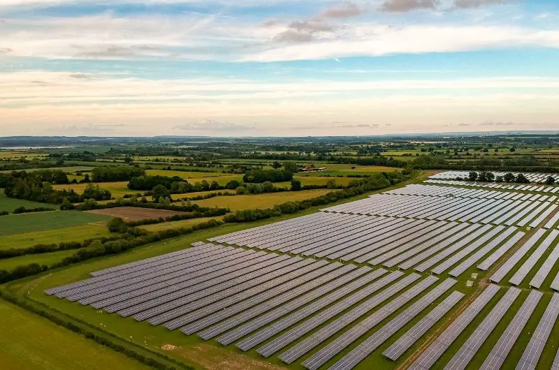 A large solar farm used to generate energy and sell to the grid for profit by the farm owner